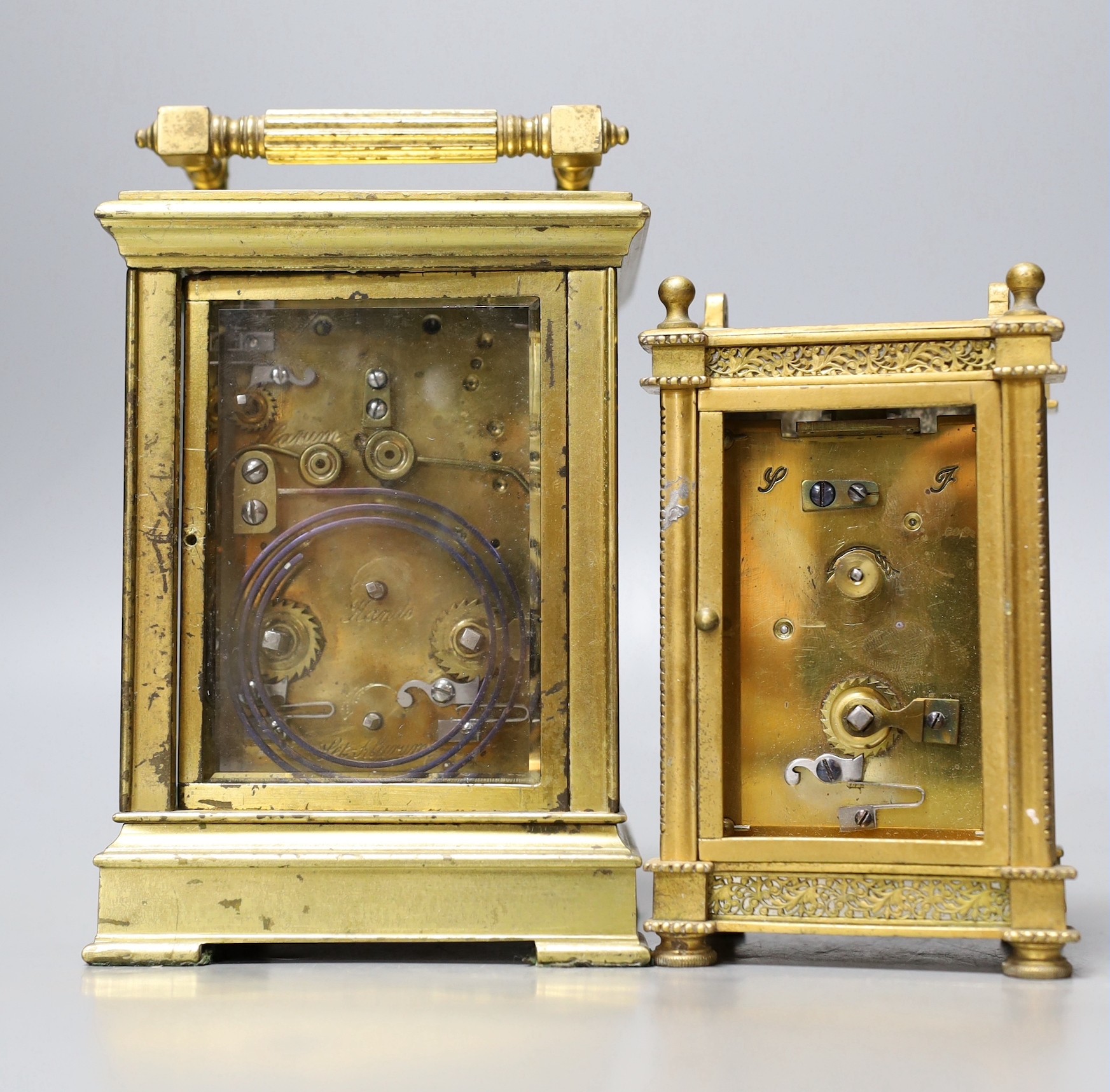 A large French repeating carriage clock with alarm, 16cm. High with handle down and a carriage timepiece